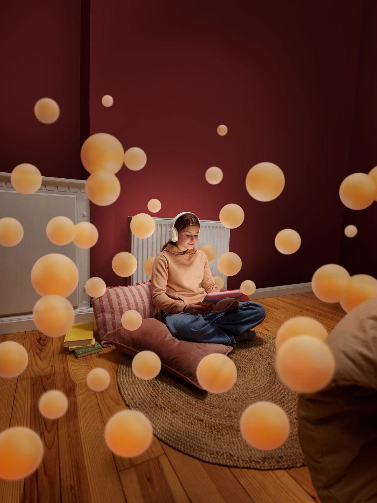 Girl reading in a cosy room with warm floors and perfect indoor temperature