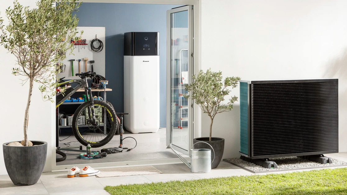 Son embracing his mother in a welcoming hallway, symbolising the comfort, warmth, and invisible impact of clean, perfectly balanced indoor air by Daikin